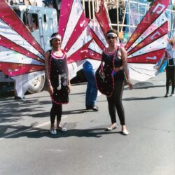 Two women in butterfly costumes at parade