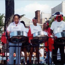 Steel drum band performing on outdoor stage