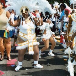 Parade dancer in white feathered carnival costume