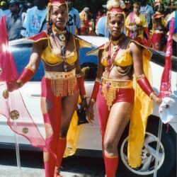 Two women in colorful carnival costumes