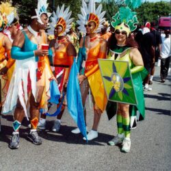 Street carnival performers in vibrant costumes