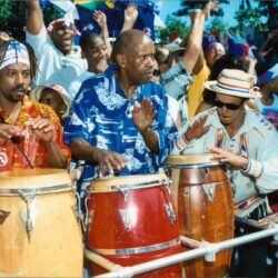 Musicians playing conga drums at street festival