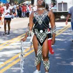 Carnival performer in ornate black-and-white costume