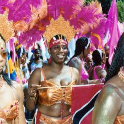 Carnival dancers in pink feathered costumes