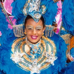 Smiling woman in elaborate blue carnival costume