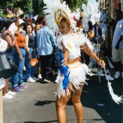 Carnival dancer in white feathered costume