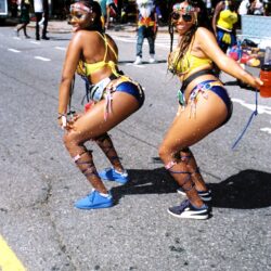 Two carnival dancers in colorful street costumes