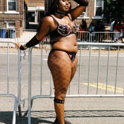 Plus-size performer in beaded carnival costume