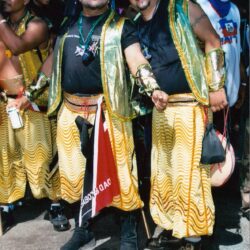 Two men in gold carnival costumes