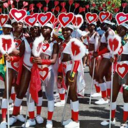 Group of women in red heart carnival costumes