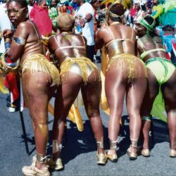 Group of carnival dancers in gold costumes