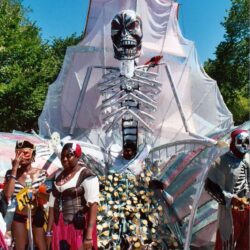 Giant skeletal pirate float with costumed participants