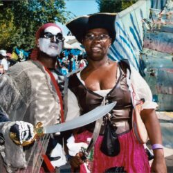 Two costumed festival participants with sword