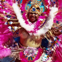 Performer in vibrant pink carnival costume