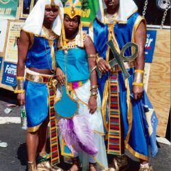 Three people in Egyptian-themed costumes