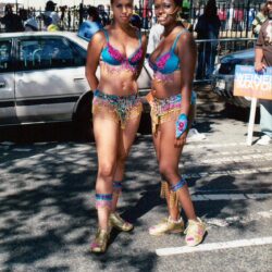 Two women in colorful carnival costumes