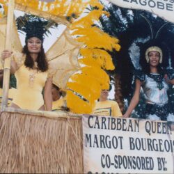 Two Caribbean carnival queens on decorated float