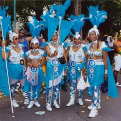 Women in blue feathered carnival costumes