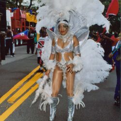 Carnival dancer in white feathered costume