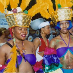 Two women in colorful carnival costumes