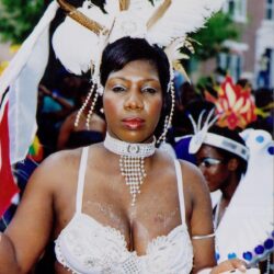 Woman wearing white feathered carnival costume