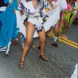 Women dancing in colorful carnival costumes