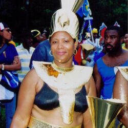 Woman in gold carnival costume with headdress