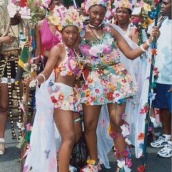 Women in colorful floral carnival costumes