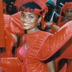 Smiling woman in red carnival costume