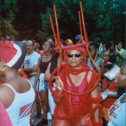 Person in red lobster costume at outdoor parade