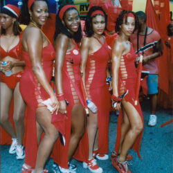 Women in red carnival costumes at parade