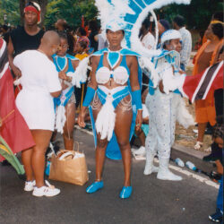 Carnival dancer in blue feathered costume