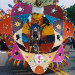 Performer in oversized colorful carnival parade costume