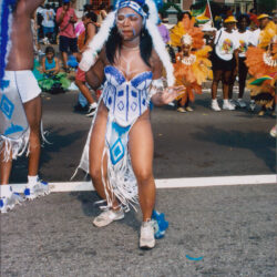 Carnival dancer in blue feathered street parade