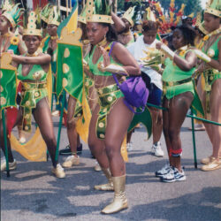 Women in green carnival costumes at parade
