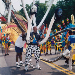 Parade performer with multi-headed tentacle costume