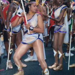 Carnival dancers in feathered costumes at parade