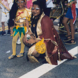 Woman and child in colorful carnival costumes