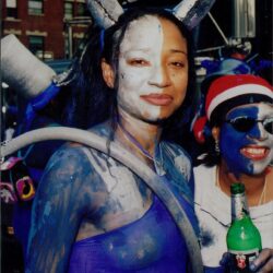 People in colorful festival costumes and paint.