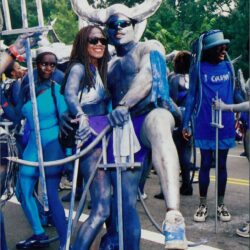 People in blue costumes at a parade.