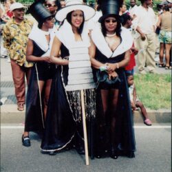 Women in elaborate costumes at a parade.