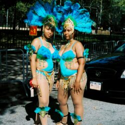 Two women in colorful carnival costumes.