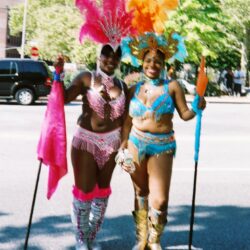 Two women in colorful carnival costumes.