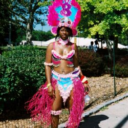 Carnival costume with colorful feathers and beads.