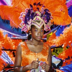 Carnival costume with vibrant feathers and decorations.