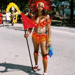 Carnival dancer in red feathered costume