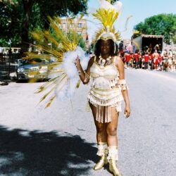 Carnival performer in white and gold costume