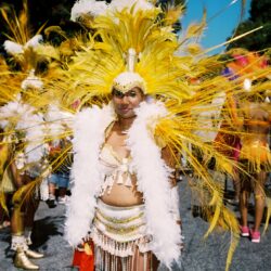 Carnival costume with yellow and white feathers.