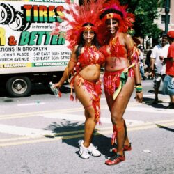 Two women in colorful carnival costumes.