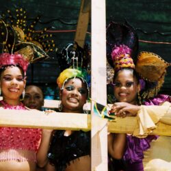 Women in colorful costumes at a festival.